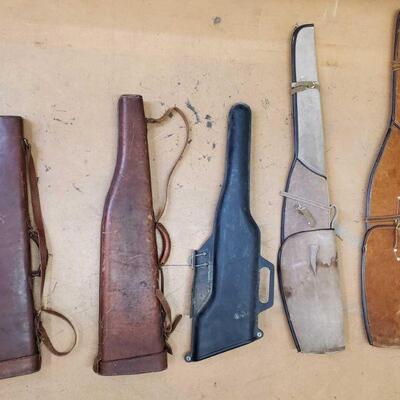 2200	

Five Rifle Cases
4 Leather Rifle Cases 1 Hard Plastic Rifle Case Measurements ranging from 29.5"-48"