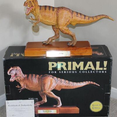 Tyrant King figure with wood base from Safari Ltd. PRIMAL! for Serious Collectors. Scale is 1:20. Includes Certificate of Authenticity. 