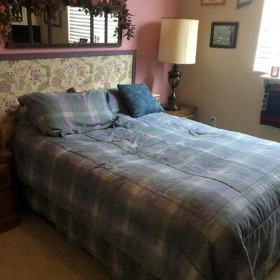 Twin bed with mattress, bedframe, headboard, bedding. Wall Mirror above bed
