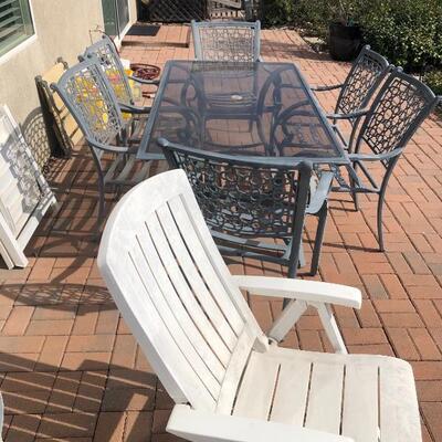 Wrought iron and glass table patio set with 6 chairs