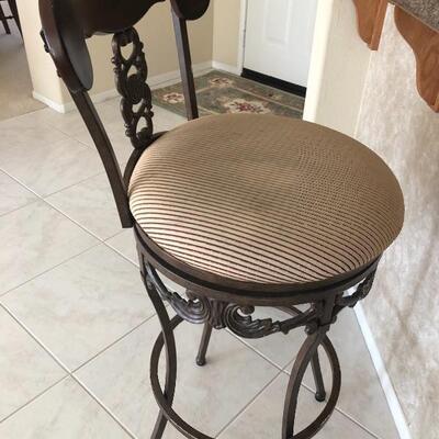 Front of elegant wrought iron bar stool
