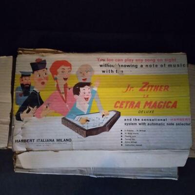 https://ctbids.com/#!/description/share/749507 Vintage Junior Zither, made in Italy with music sheets and still has original box. 14
