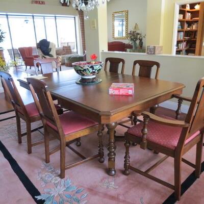 ANOTHER VIEW OF THE DINNING ROOM TABLE AND 8 MATCHING CHAIRS