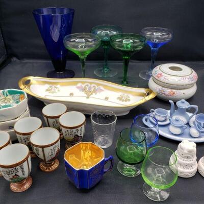 Includes miniature tea set, salt and pepper shakers, sake set, dish, candle holder and glasses. Tallest measures 6