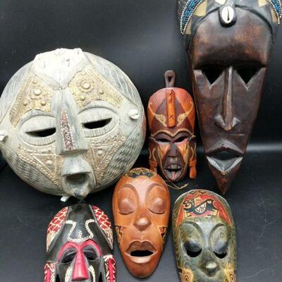 These masks were purchased at World Market by owners. They are beautifully hand carved and decorated in Africa. Round:10