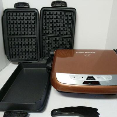 This top of the line George Foreman Deluxe Grill comes with ceramic grill plates, nonstick fry plate and waffle iron attachments....