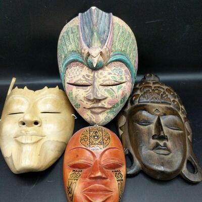These beautifully created masks were purchased by owner at Ten Thousand Villages. Light wood:9.5