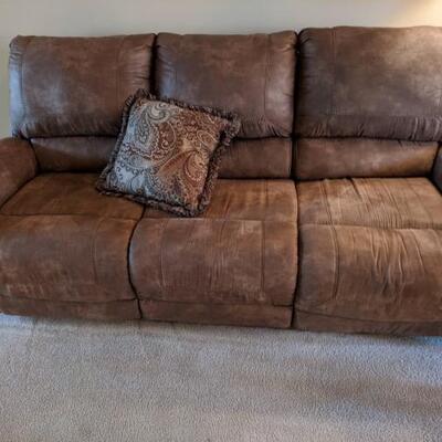 Microfiber sofa with electric recliners at each end. Measures 90