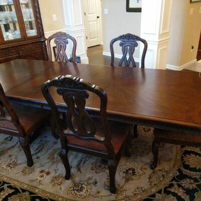Beautiful pedestal table and 6 chairs from Ashley Furniture North Shore collection. Table has a classic trestle base and scalloped edge....