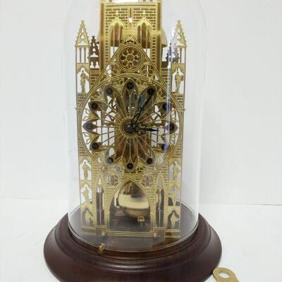 Beautiful Hermle skeleton clock manufactured in West Germany and dated 1984. Clock sits under a glass globe and includes crank key and...