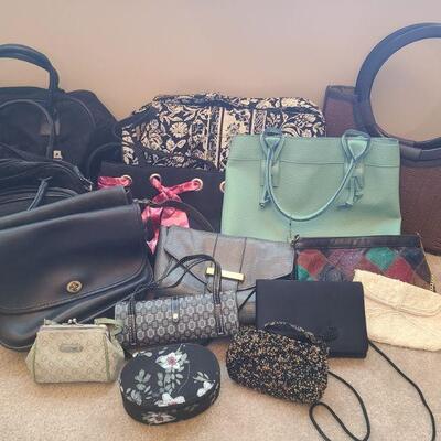 Sixteen bags of different syles and sizes. Two matching Coach bags one in ok condition and ones in good condition. All other bags are...