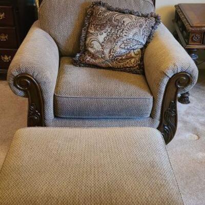 Beautiful Ashley Furniture Martinsburg chenille chair with matching ottoman. Chair has ornate design on front and legs and measures 41