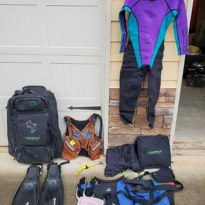 Akona Adventure Gear bag full of scuba gear. Includes small wetsuit, flippers, snorkel, mask, gloves and more. Sizes Small and XS....