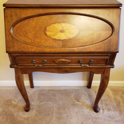 Beautiful slant front secretary desk from Ashley Furniture. Desk has a small drawer for pens and pencils, slots for mail and 4 small...