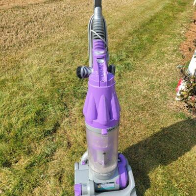 Upright purple Dyson DC-07 Animal vacuum cleaner. Lifetime Hepa Filter. It stands 46