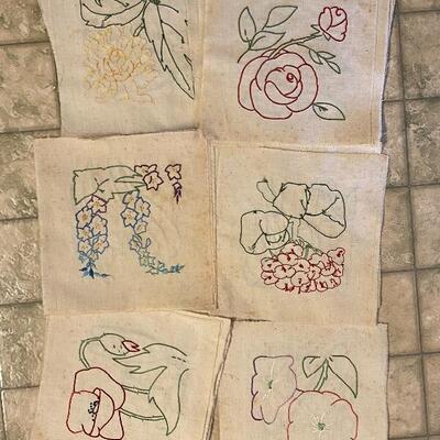 Hand embroidered quilt top pieces.