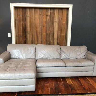 Haverty’s gray leather sectional with chaise 
114 “L x (62” chaise) x 36” D x 24” arm height 
$875