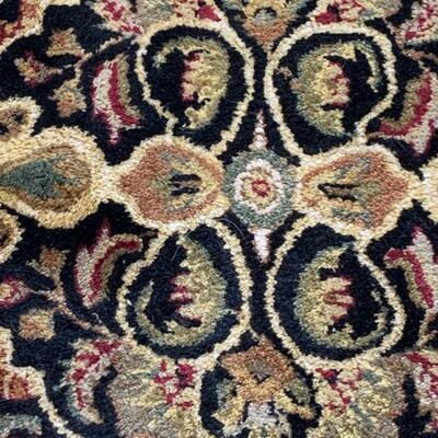 Lot #31--wool rug from India, black, tan, red, green--$125--5'6