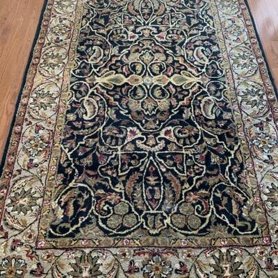 Lot #31--wool rug from India, black, tan, red, green--$125--5'6