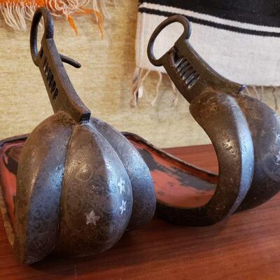 A pair of antique Japanese Abumis, stirrup for horse-riding, in cast iron with elaborate silver inlay.