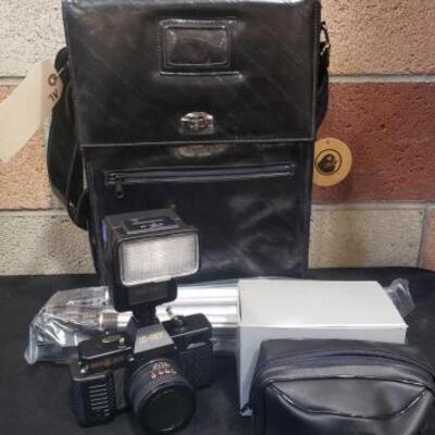 #948 â€¢ Gold Seal K-707 Camera with Case, Flash, and Tripod
