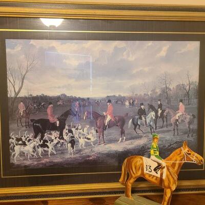 Photo of men preparing for a fox hunt. Measures 40" x 2" x 30" with frame. This is a print no artist name was found....