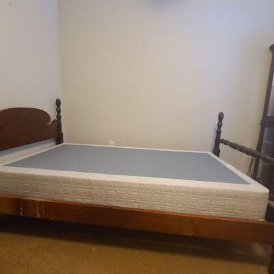 Wooden bed frame does come with box spring but no mattress. Measures 80" x 41" x 43". No screws or metal, sides just slide...