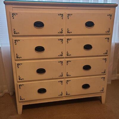 Beautiful white four drawer dresser with painted on ivy. In good condition, measures 36