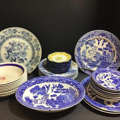 Assorted blue, white and yellow dishes. Blue and white floral are Old English by Johnson Bros. England....