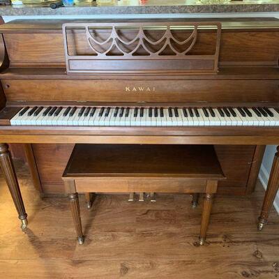 This is an Kawai upright piano with all keys working and pedals as well. It includes an assortment of sheet music and the piano bench but...