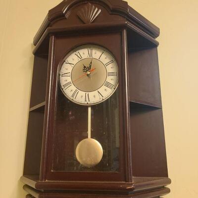 Clock does not work at this moment but shelf and all is in good condition. Measures 15" x 6" x 22"....