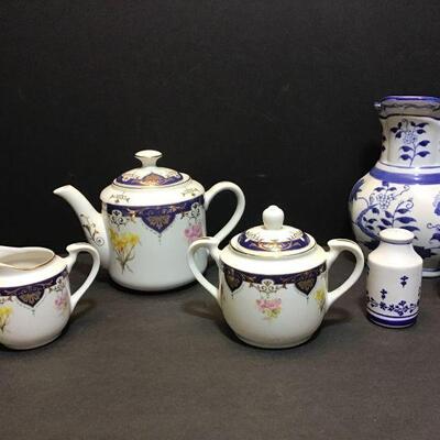 Andrea by Sadek 3 piece tea set. Teapot 7â€. Blue and white flat back vase 8â€, salt and pepper shakers 4â€....