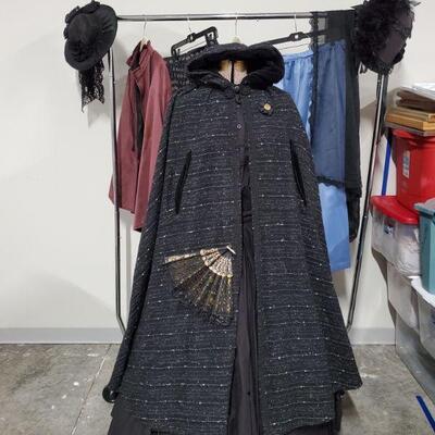 Beautiful collection of women's Civil War Reenactment clothing. Black outfit is 2 piece with cloak, hoop skirt and fan. Clothing is...