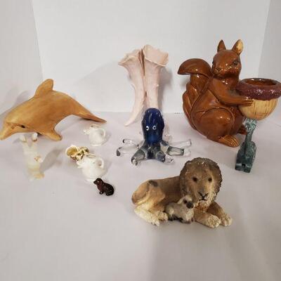 Collection of animals. Includes a cute ceramic squirrel with acorn that can hold a candle votive 7", a wooden dolphin, glass octopus...