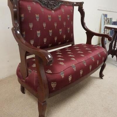 1042	CARVED MAHOGANY SETTEE W/CURVED ARMS, 50 IN WIDE X 44 IN HIGH
