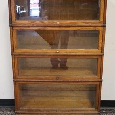 1017	OAK 4 SECTION BARRISTER BOOKCASE, ONE GLASS IS BROKEN, 34 IN WIDE X 56 IN HIGH
