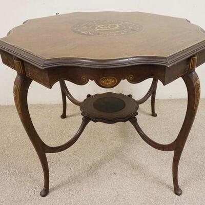 1025	INLAID TABLE W/SCALLOPED TOP & SKIRT, CABRIOLE LEGS, SOME INLAY MISSING ON THE OUTER EDGE, 36 IN ACROSS, 29 1/2 IN HIGH
