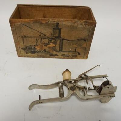 1006	ANTIQUE SEWING MACHINE W/ORIGINAL WOODEN BOX, BOX HAS DETAILED OPERATING INSTRUCTIONS, 8 IN LONG
