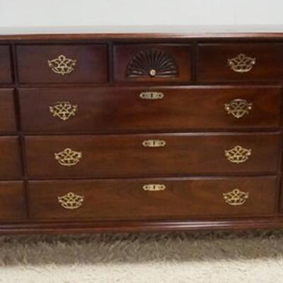 1062	STATTON 14 DRAWER LOW CHEST, TOP CENTER DRAWER HAS A SHELL CARVING, CHERRY, 65 3/4 IN WIDE X 34 3/4 IN HIGH
