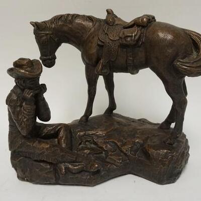 1001	AUSTIN PROD. COWBOY SCULPTURE, HORSE & COWBOY PLAYING A HARMONICA BRONZE FINISH PLASTER, 14 IN WIDE X 11 1/2 IN HIGH
