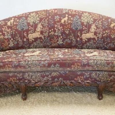 1020	CARVED UPHOLSTERED SOFA W/KNIGHT POSTS, HAS UNICORN & DOG UPHOLSTERY, KNIGHTS ARE ACCENTED W/GOLD, APPROXIMATELY 78 IN WIDE X 38 IN...