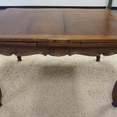 1048	CARVED OAK REFRACTORY TABLE, HAS CABRIOLE LEGS & CARVED SKIRT, EXPANDS TO 89 1/2 IN, 39 1/4 IN X 51 1/4 IN CLOSED
