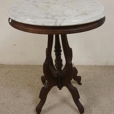 1098	OVAL WALNUT MARBLE TOP TABLE 22 IN X 16 1/2 IN 30 1/4 IN H 
