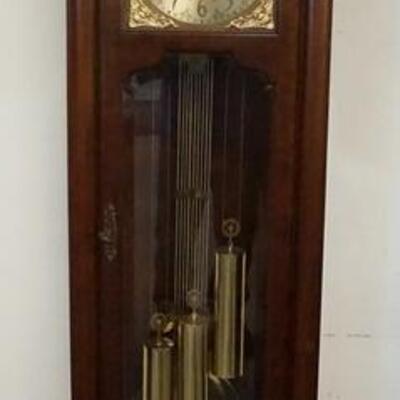 1045	COLONIAL TALL CASE CLOCK W/MOON DIAL, HANDS ARE MISSING, FRONT GLASS DOOR BEVELED, 21 IN WIDE X 80 1/2 IN HIGH
