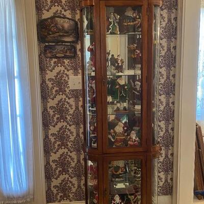 Curio cabinet with curved glass sides