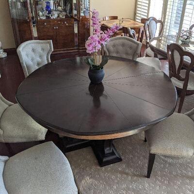 60 inch diameter round wood table expands to 72 inch with built ins.  Remains round (no leaf insert).