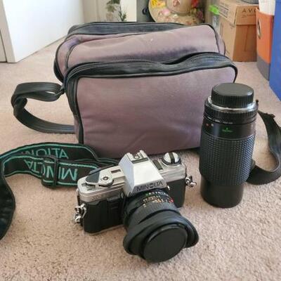 4002	

Minolta Camera With Lens And Case
Minolta Camera With Lens And Case