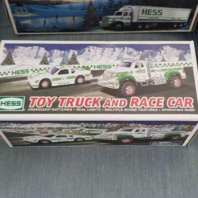 Two toy Hess trucks