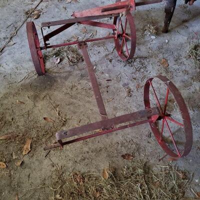 This looks like a fairly old wagon, however it is missing one wheel