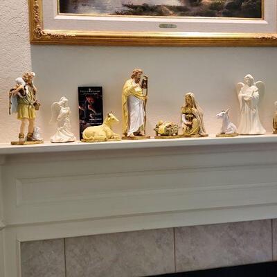 an array of different ceramic figurines to a Nativity set